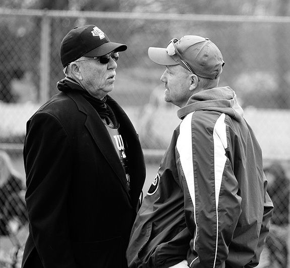 Brad Fisher discusses a play with the umpire